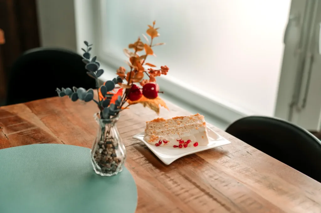 Cake and flowers on a table in the café at Christian Centre Martin