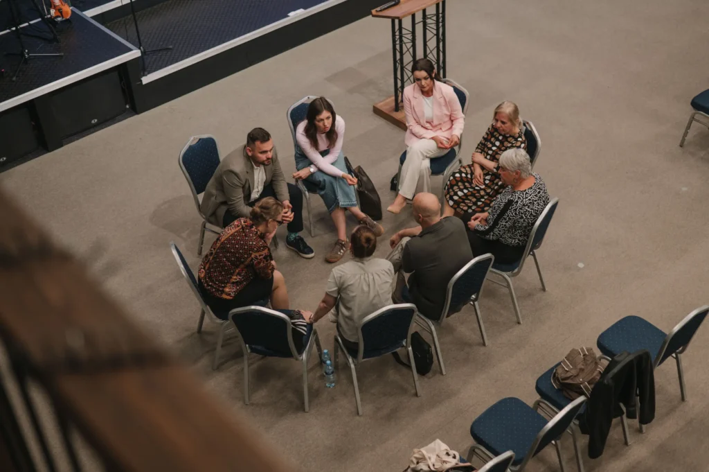 A small group talking in a circle at Christian Centre Martin